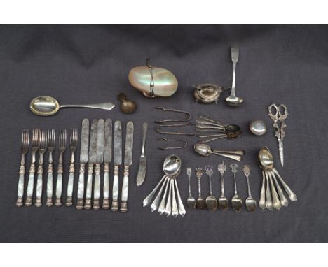 A George V silver dessert set, comprising a serving spoon and a set of six dessert spoons, Sheffield, 1920, C W Fletcher &amp