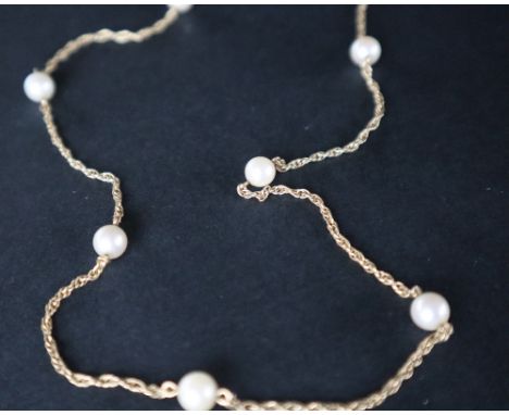 A 9ct gold pearl necklace, mounted with seven pearls on a rope twist chain, 58.5cm long, approximately 6.5 grams