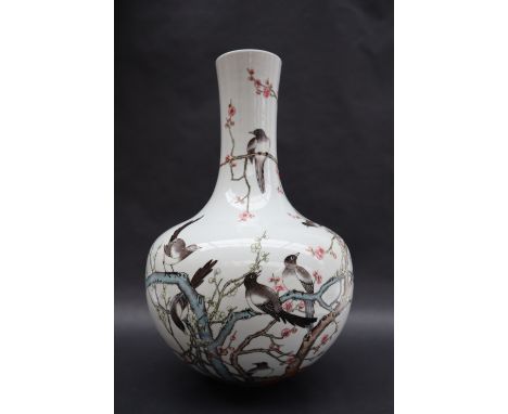 A Chinese porcelain bottle vase, decorated with magpies perched amongst a blossom tree, seal mark to the base, 38cm high  CON