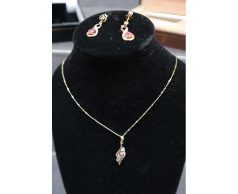 A 9ct gold ruby set pendant, together with similar earrings, A Dunhill roller ball pen, faux pearls, bangle earrings etc