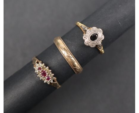 A 9ct gold wedding band size R together with a 9ct gold ruby and diamond ring and a 9ct gold sapphire and diamond ring, overa