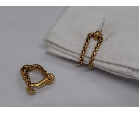 A pair of Boucheron yellow metal cufflinks of woven chain form and hook shaped fastenings, impressed mark, No. 28045, stamped
