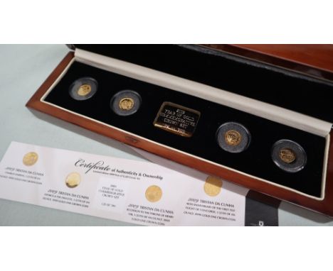A 2009 Year of Gold commemorative crown set, including a Charles Darwin 1/25th of an ounce .9999 gold one crown coin, George 