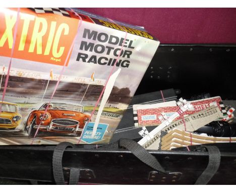 A boxed Scalextric set No 65 with various accessories and a packing trunk with a large selection of Scalextric spare track, c