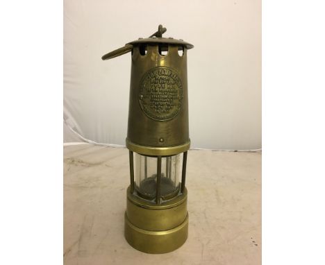 A brass miner's lamp