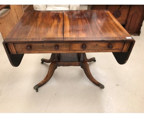 A George III rosewood sofa table on 4 swept legs