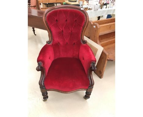 A Victorian mahohany framed button back chair