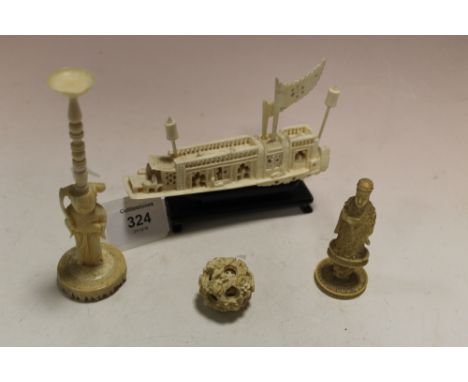 AN ANTIQUE IVORY CARVED PUZZLE BALL AND STAND, overall H 16 cm, together with a carved figural chess piece and a carved model