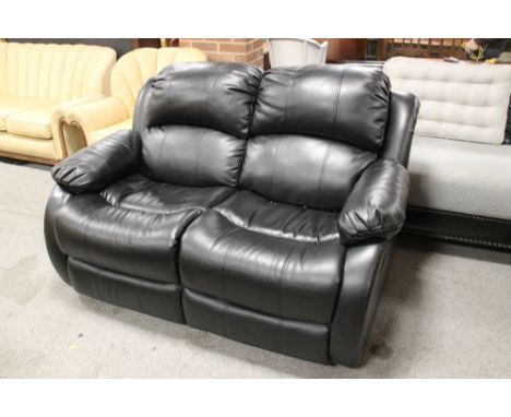 A BLACK LEATHER RECLINING TWO SEATER SOFA