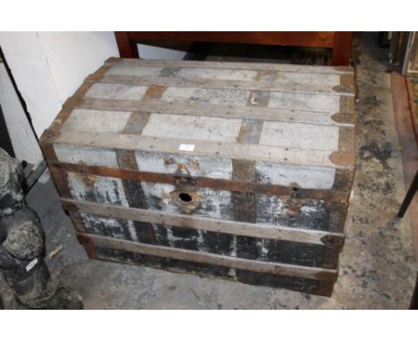 A LARGE VINTAGE TRAVEL TRUNK