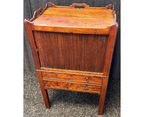 19th Century wash unit, the tray surface above a tambour front and pull out lower section opening to revel commode, raised on
