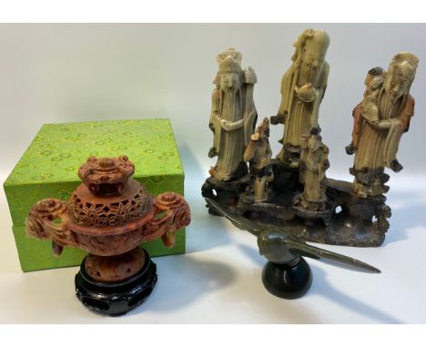 Chinese carved soapstone figures on stand, Chinese carved incense burner in fitted box and an Eskimo Art bird sculpture. 