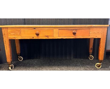 Farmhouse pine, kitchen work bench, with two drawers raised on squared tapered legs on roller feet. [ 81cm x 179cm x 62cm ] 