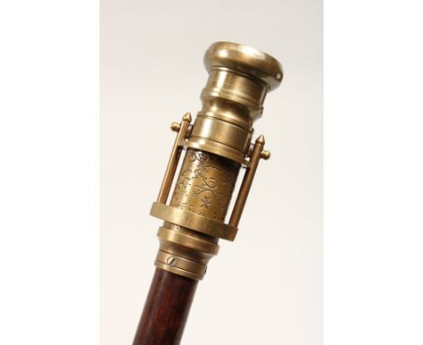 A NOVELTY WALKING STICK, the handle as a telescope and compass. 39ins high.