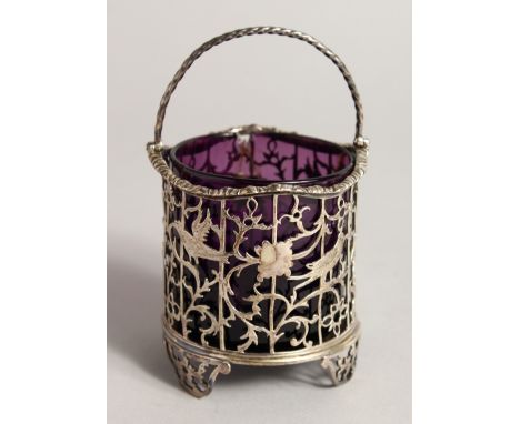 A SILVER SWING HANDLE CREAM PAIL, of open design with pierced and engraved decoration depicting birds on branches with amethy