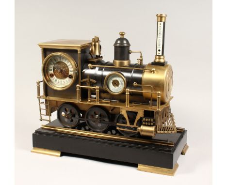 AN UNUSUAL INDUSTRIAL STYLE COMBINATION CLOCK, THERMOMETER AND BAROMETER, modelled as a train mounted on a marble base. 18.5i