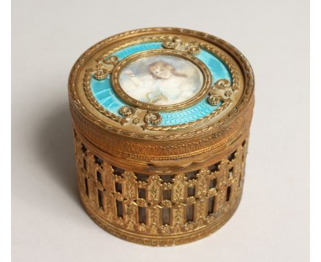 A FRENCH CIRCULAR GILDED METAL AND ENAMEL BOX with portrait of a young girl and mirror inside the lid. 3.5ins diameter, x 3in