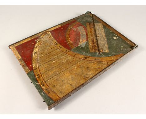 AN EARLY POSSIBLY 17TH CENTURY PAINTED WOODEN SUNDIAL 15ins x 10.5ins