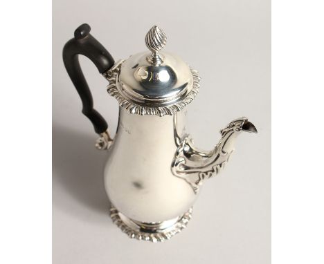 A SILVER COFFEE POT, with reeded finial, gadrooned rim and foot rim. London 1887 14ozs 8.5ins high