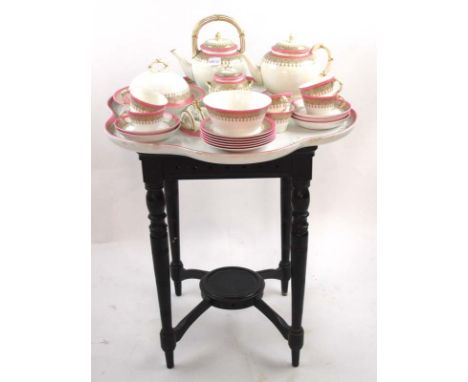 A late 19th century Royal Worcester tea set with pink and gilt decoration, comprising of a tea pot and coffee pot, toast rack