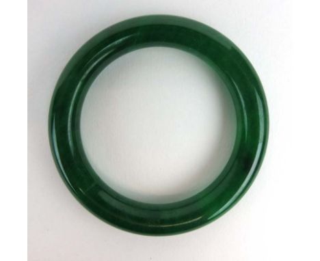 A dark green jade bangle, internal d. 5.9 cm