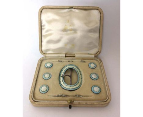 A cased silver and guilloche enamel buckle and stud set. Hallmarked for Birmingham, 1911 CONDITION REPORT: Some minor losses 