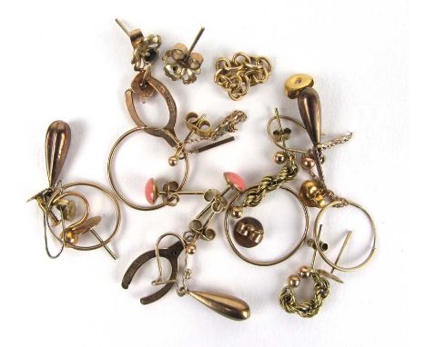 An assortment of 9ct gold and yellow metal items to include mainly earrings. Approx weight 8g