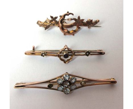 A 9ct gold amethyst and seed pearl brooch together with a pale blue topaz and seed pearl brooch A/F and one other. Approx wei