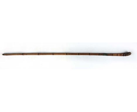 A 19th century bamboo sword stick with a curved handle and square tapering blade. l. 86 cm CONDITION REPORT: Some splitting t