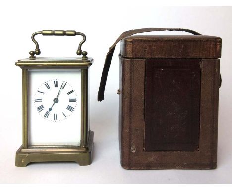A French brass cased five beveled glass carriage clock, the enameled face with Roman numerals in original carry case, h. 14 c
