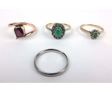 A 9ct gold amethyst crossover ring together with two 9ct gold green stone cluster rings and a palladium band. Approx weight 7