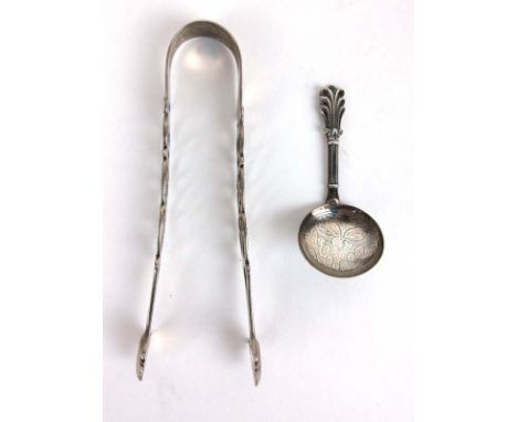 A William IV silver caddy spoon having fluted handle and engraved bowl, together with a pair of Georgian silver sugar tongs w