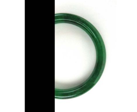 A dark green jade bangle, internal d. 6.1 cm