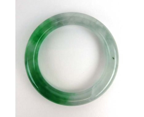 A green jade bangle, internal d. 5.6 cm