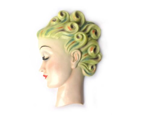 An Art Deco Goebel wall mask modelled as a profile of a girl with curled hair. Designed by Agnes Richardson, factory marks to