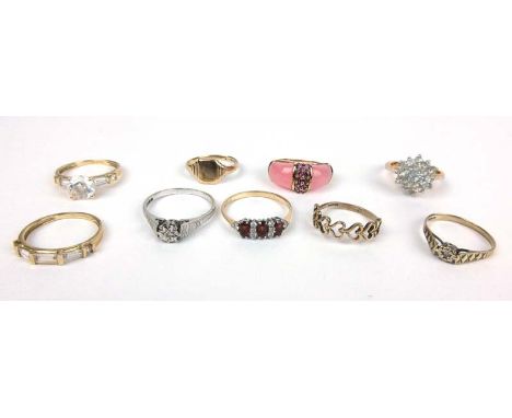 A group of nine rings consisting of two 14ct dress rings, five 9ct gold rings and two yellow metal rings. Various styles and 