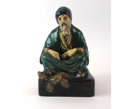A Royal Doulton figure 'The Cobbler' in green and blue robes, HN 542., h. 21 cm CONDITION REPORT: Some crazing and loss of pa