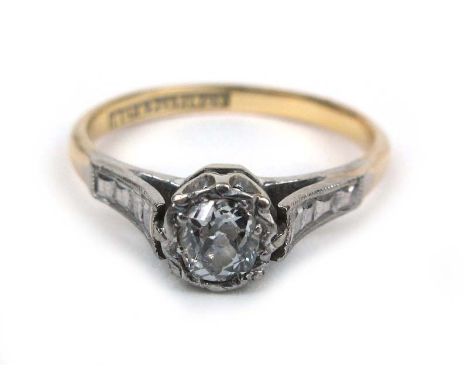 An 18ct yellow gold and platinum diamond solitaire ring, the round cut stone approximately 0.33ct.  CONDITION REPORT: Minor m