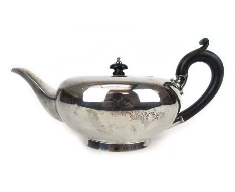 A George VI silver teapot of squat form. Hallmarked for Birmingham,1945. Approx weight 632g CONDITION REPORT: Marks, tarnish,