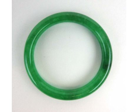 A dark green jade bangle, internal d. 5.9 cm