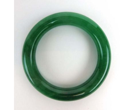A dark green jade bangle, internal d. 5.8 cm