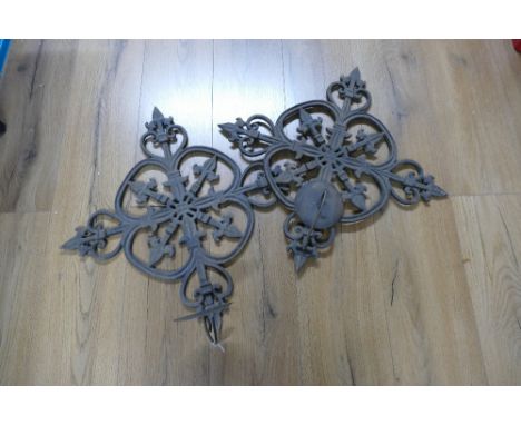 Pair of metal architectural wall mounted candle holders  