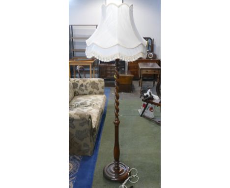 Oak standard lamp barley twist carving to the upper portion and cream shade 