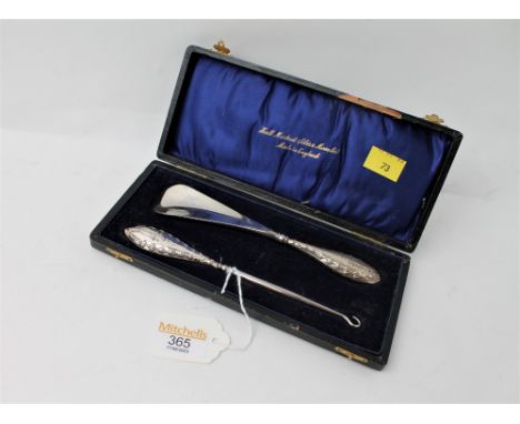 Cased silver handled shoehorn and button hook 