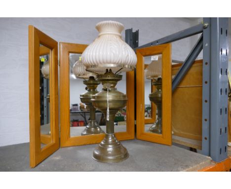 Duplex brass oil lamp with peach glass shade and a folding dressing table mirror 