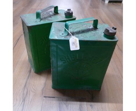 Two green Shell BP petrol canisters