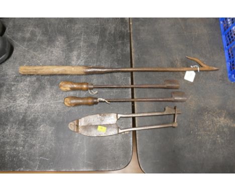 Four antique cast iron tools