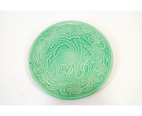 A Burleigh ware pottery green glazed Art Deco style charger, 20th century printed marks, moulded in relief with a stylised de