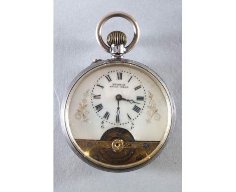 An Etonia open faced manual wind pocket watch with visible escapement to dial. Inner case marked for silver 0.935 85.1 grams