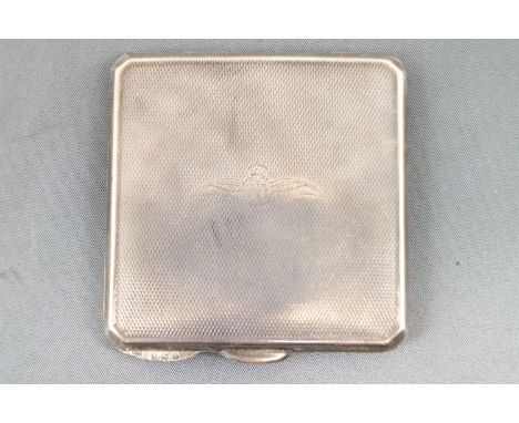 A square silver cut corner engine turned powder compact, engraved with the RAF cap badge and wings crest, Birmingham 1939, 7c